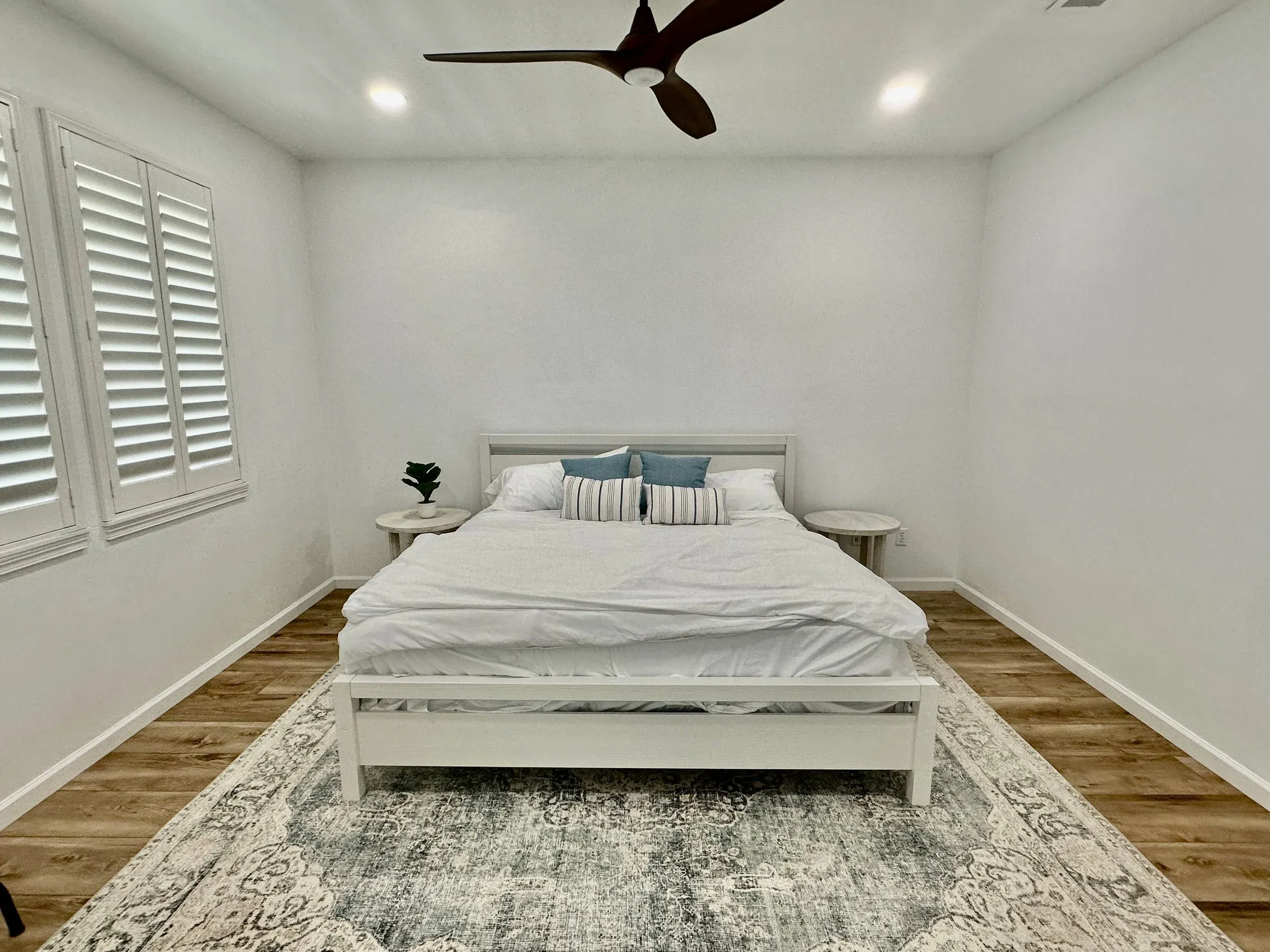 Bedroom with king bed and patterned rug