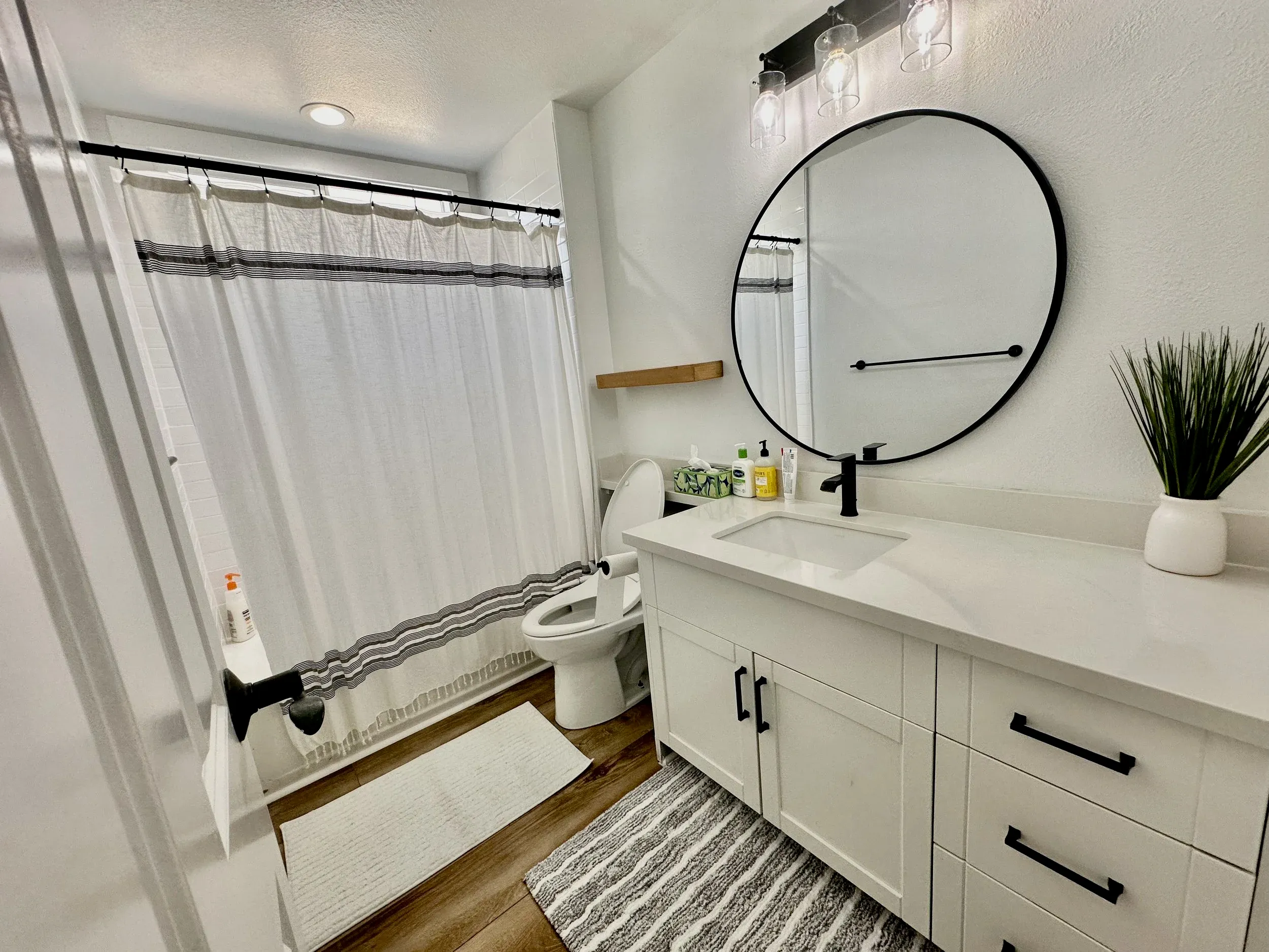 Bathroom vanity with round mirror