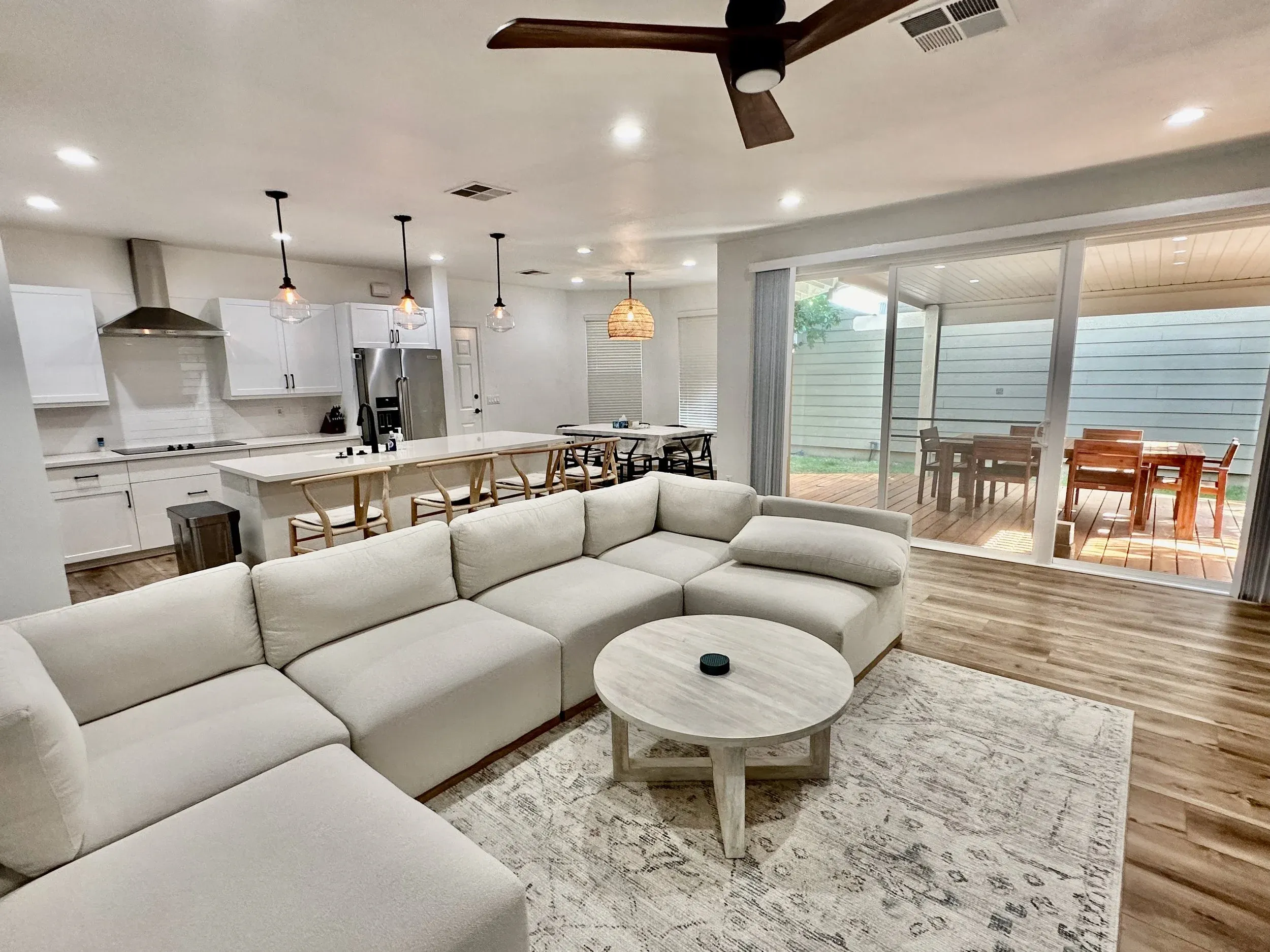 Living room with sectional sofa and open kitchen